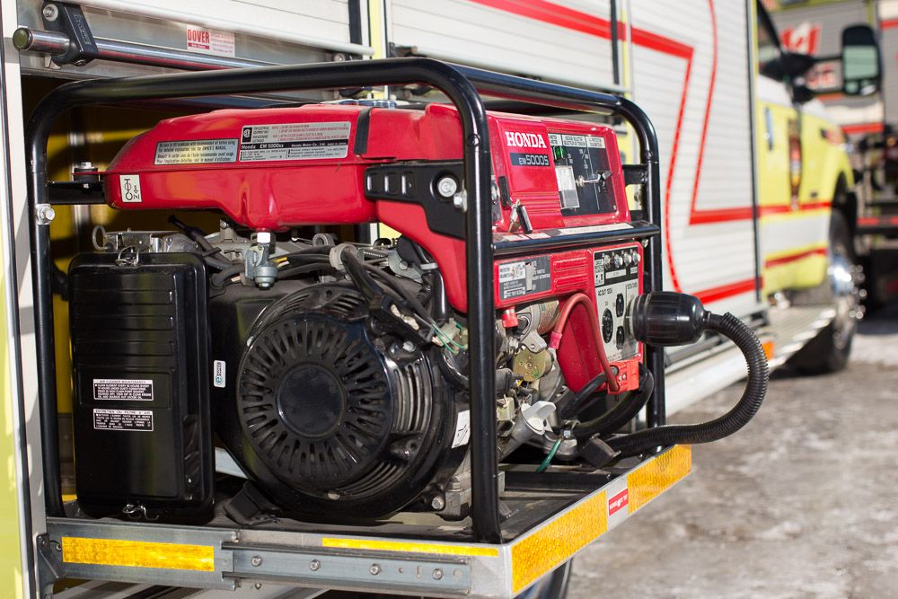 Generator and rescue equipment stowed in a truck compartment